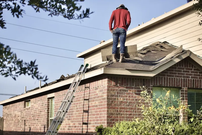 Professional roofer working on a residential roof in Downstown